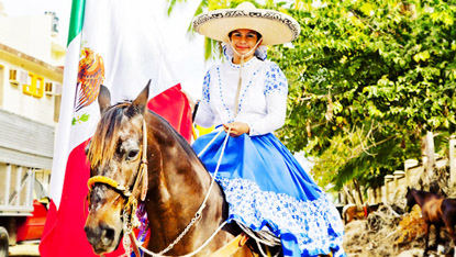 The rodeo riders are called Charros; the women, like this one, are Charras