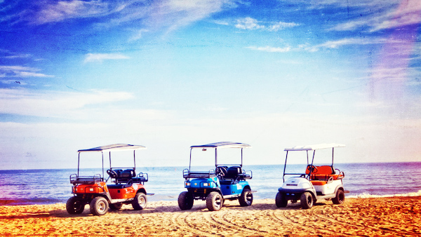 Don't do this, it's illegal! But golf carts do look sharp on the sand