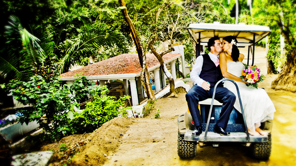Just married and out for a honeymoon spin in a golf cart