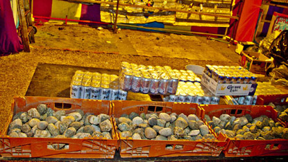 Piles of rocks, cases of beer. Throw a rock, break a bottle, win beer